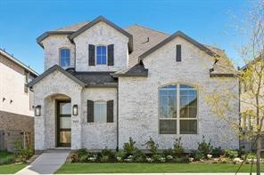 This photo shows a modern two-story brick house with an elegant facade, featuring large windows and a welcoming entrance. The well-maintained front yard has shrubs and a small tree, creating a charming curb appeal.