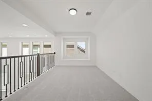 a view of staircase with white walls