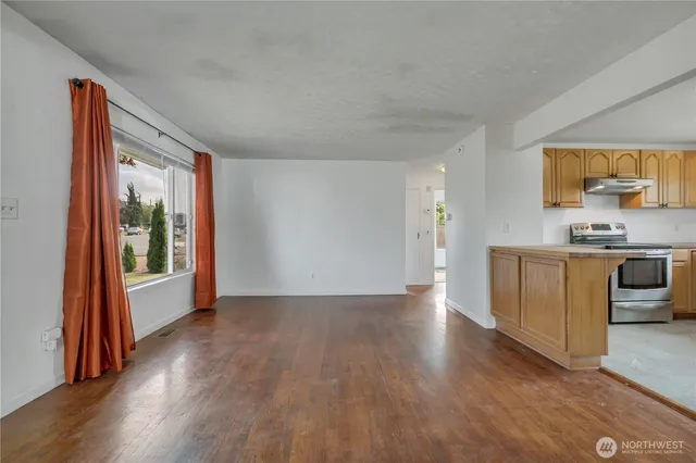 a view of a kitchen with a sink and a window
