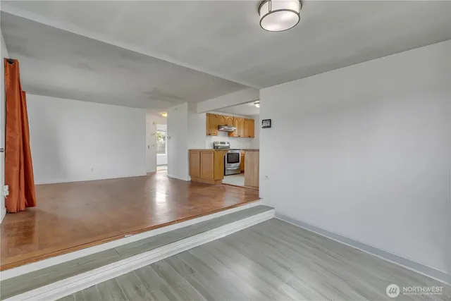 a view of kitchen with wooden floor