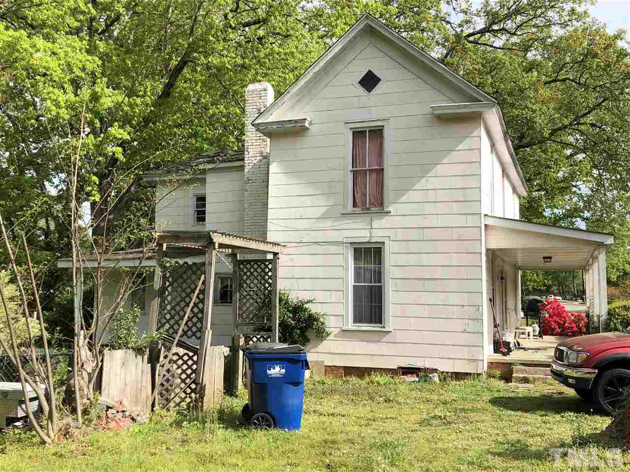208 Jones Franklin Road Raleigh, NC 27606 - Photo 4 of 5 a view of house with a yard
