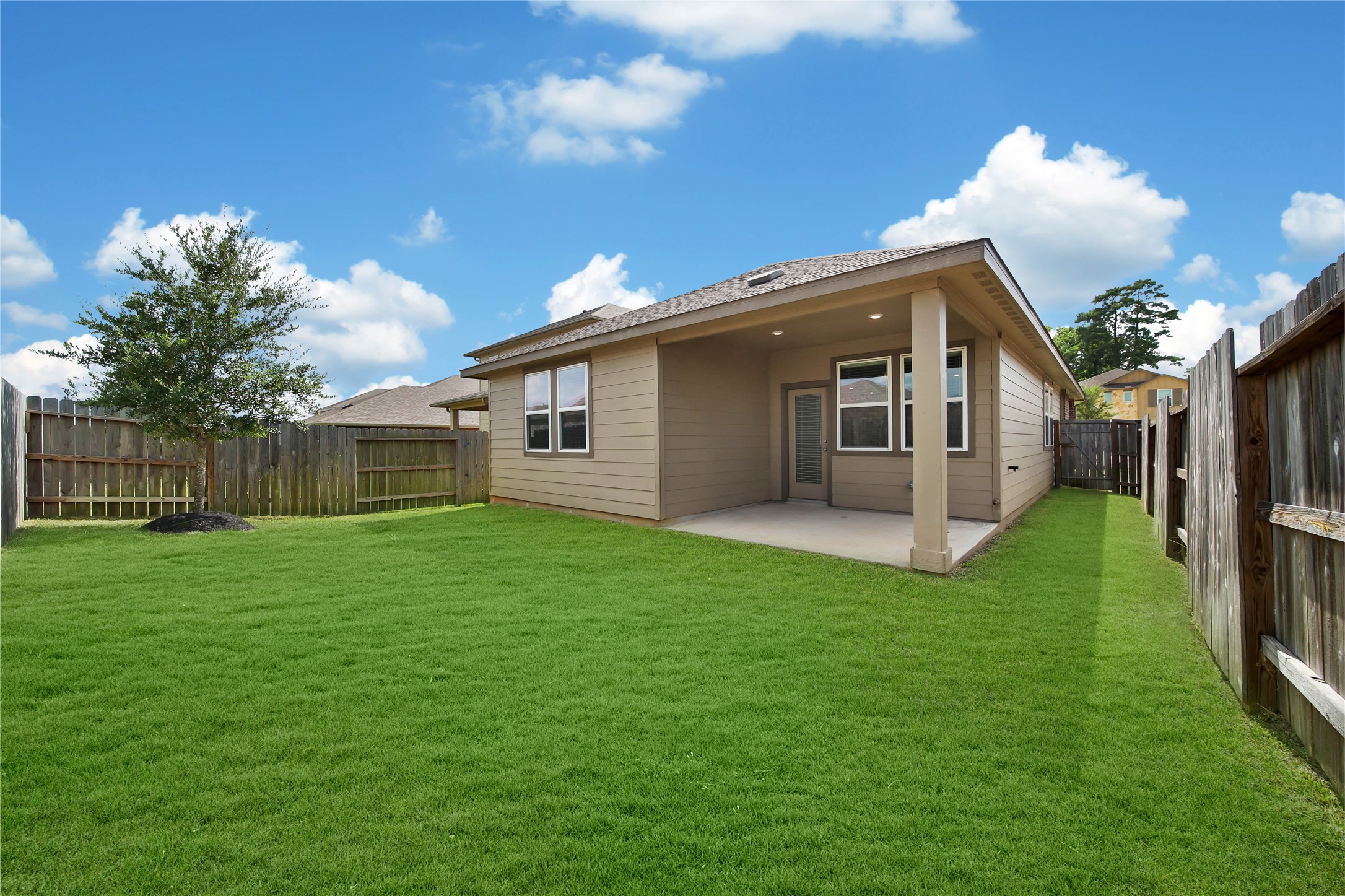 7080 Silverleaf Oak Street Conroe, TX 77304 - Photo 2 of 35 A great size backyard with room for the kiddos and pets to play. The sprinkler system makes it easy to care for your lawn. This grass has been greened by AI.