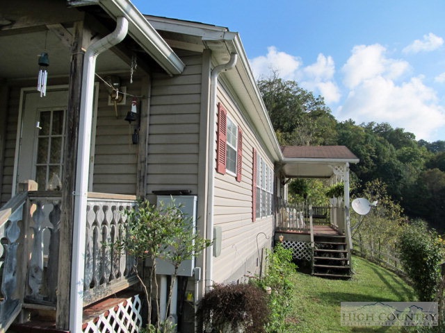 1460 East Big Springs Road Lansing, NC 28643 - Photo 1 of 40 a view of a house with a yard