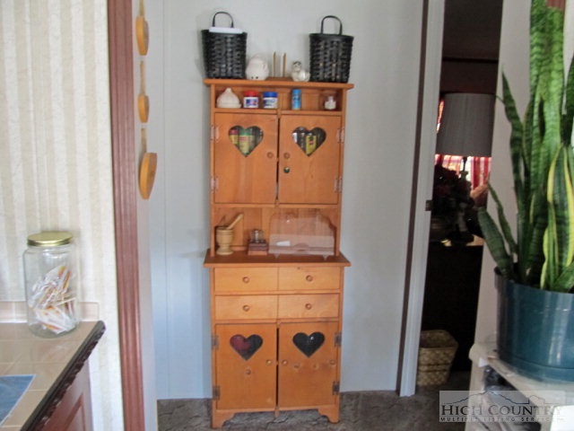 1460 East Big Springs Road Lansing, NC 28643 - Photo 4 of 40 a room with storage and utility