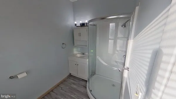 a bathroom with a shower and a toilet
