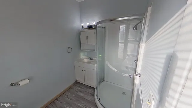 a bathroom with a shower and a toilet