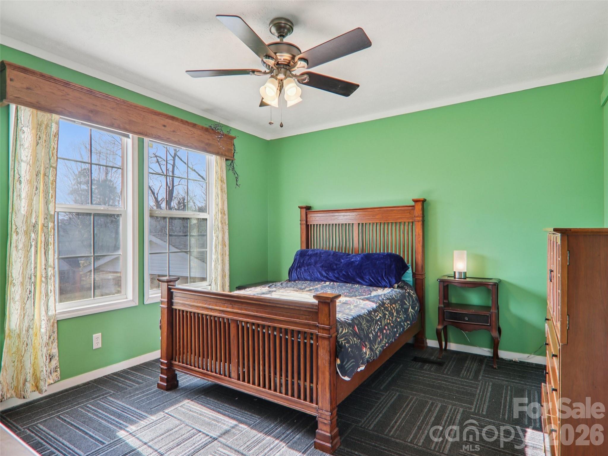 3195 North Clear Creek Road Hendersonville, NC 28792 - Photo 15 of 21 a bedroom with a bed and windows