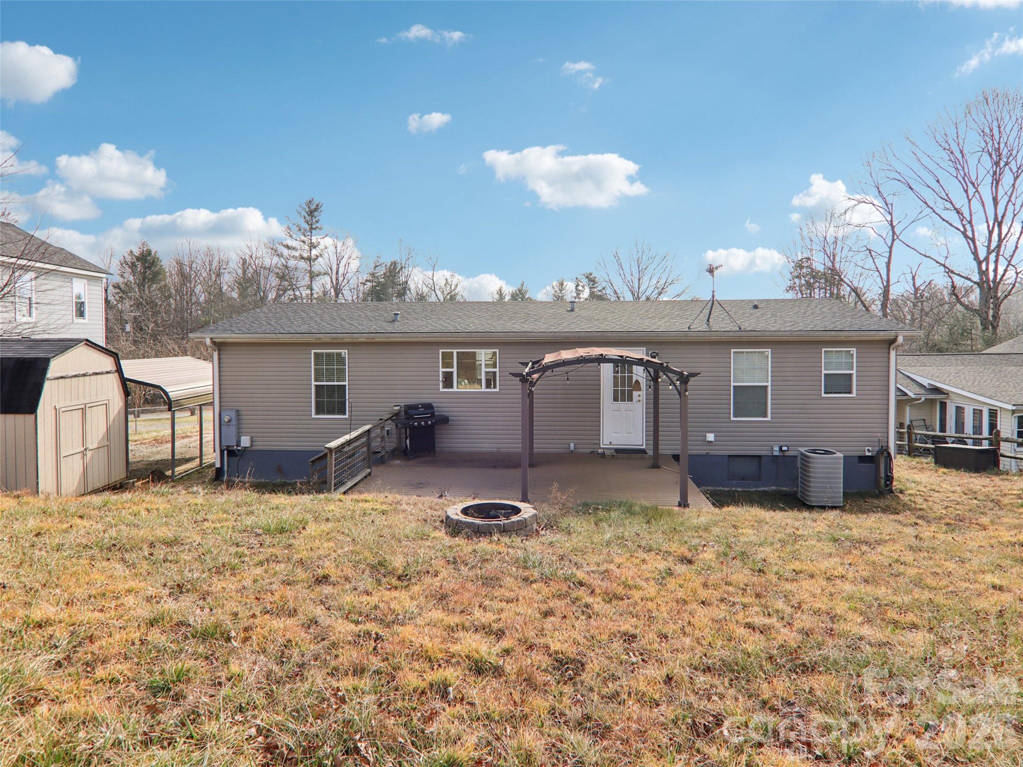 3195 North Clear Creek Road Hendersonville, NC 28792 - Photo 18 of 21 a view of a house with a yard