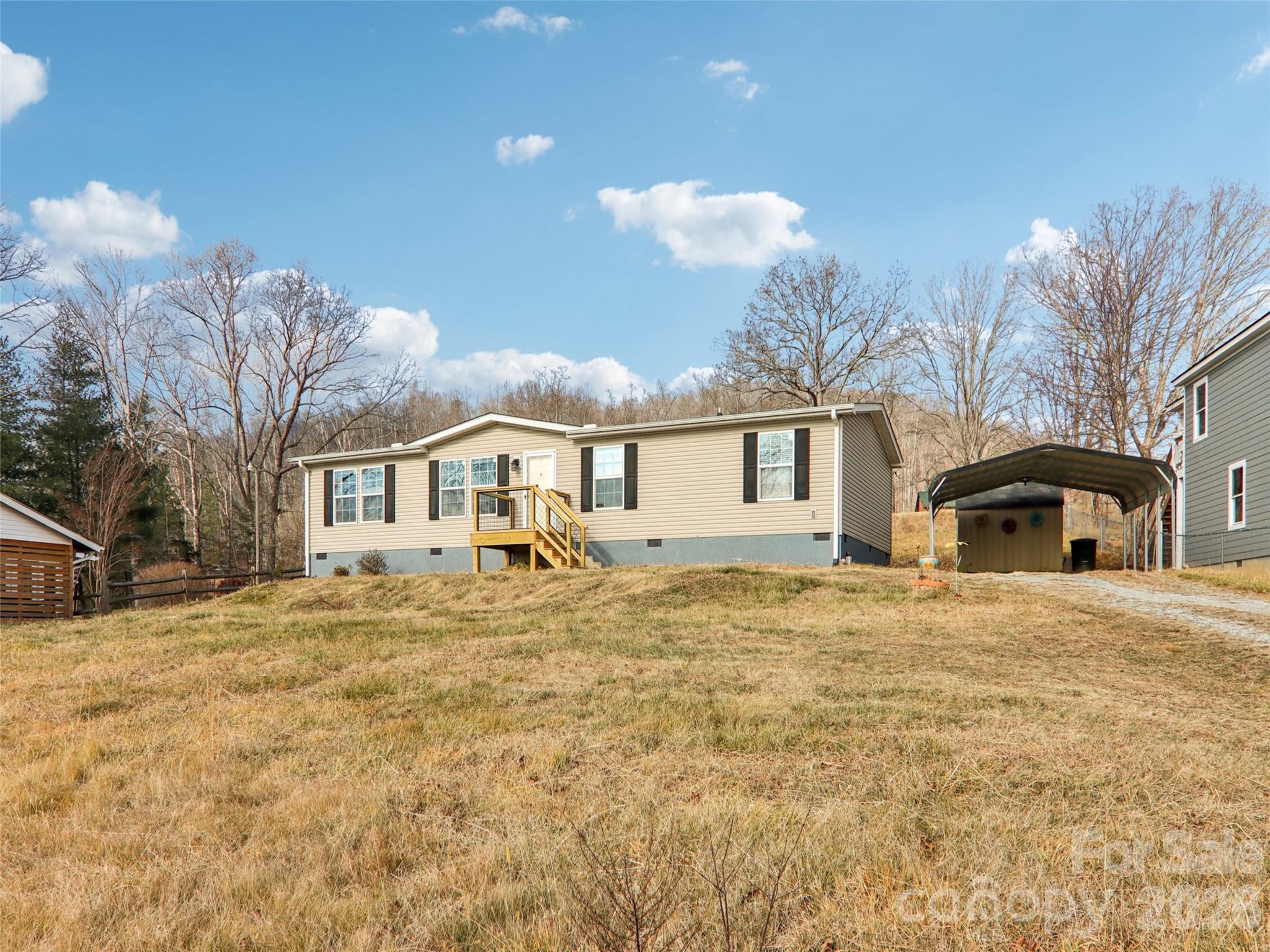 3195 North Clear Creek Road Hendersonville, NC 28792 - Photo 20 of 21 a front view of a house with a yard