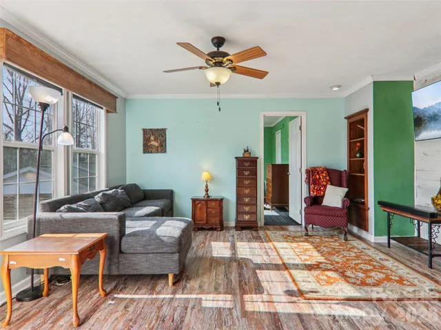 a living room with furniture and a rug