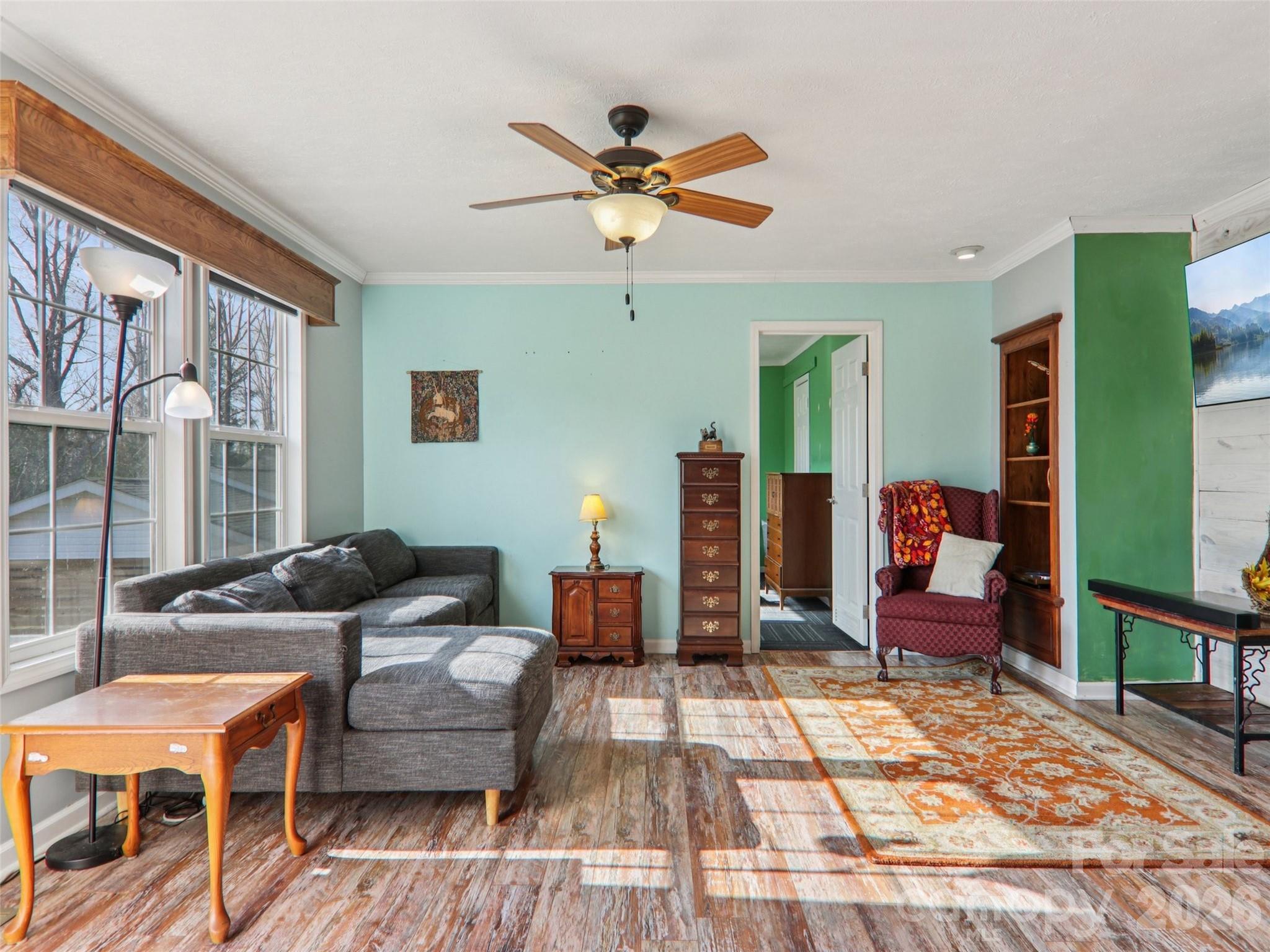 3195 North Clear Creek Road Hendersonville, NC 28792 - Photo 3 of 21 a living room with furniture and a rug