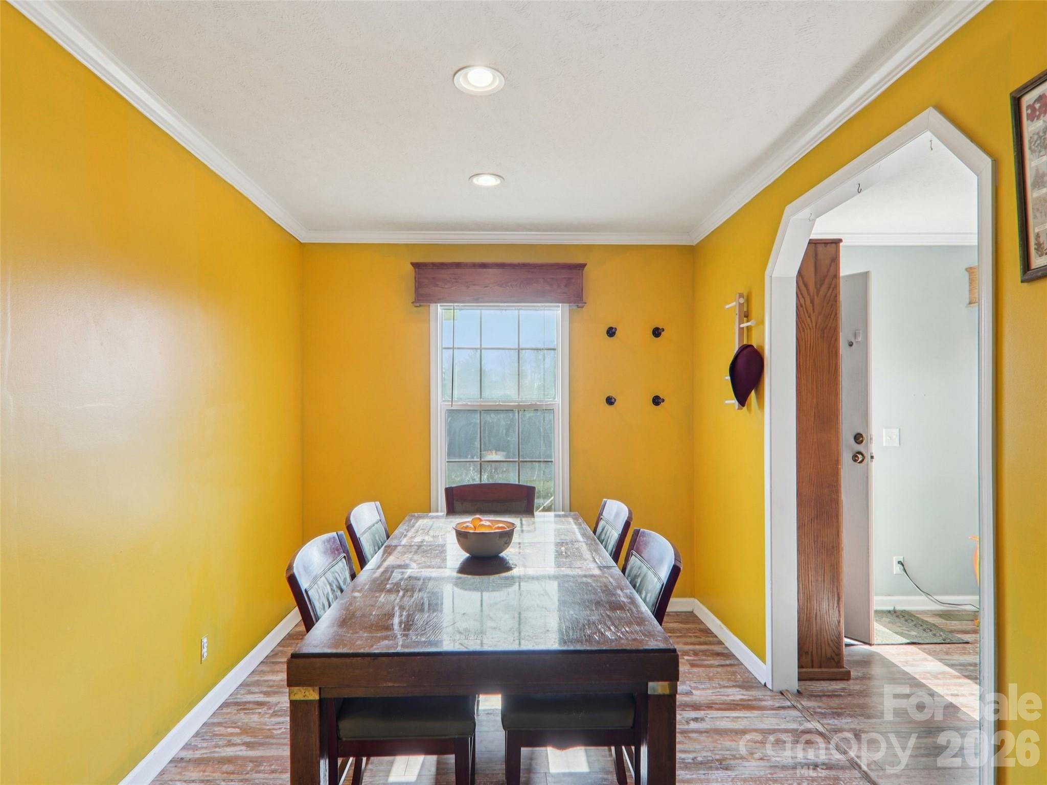 3195 North Clear Creek Road Hendersonville, NC 28792 - Photo 6 of 21 a view of a dining room with furniture and wooden floor