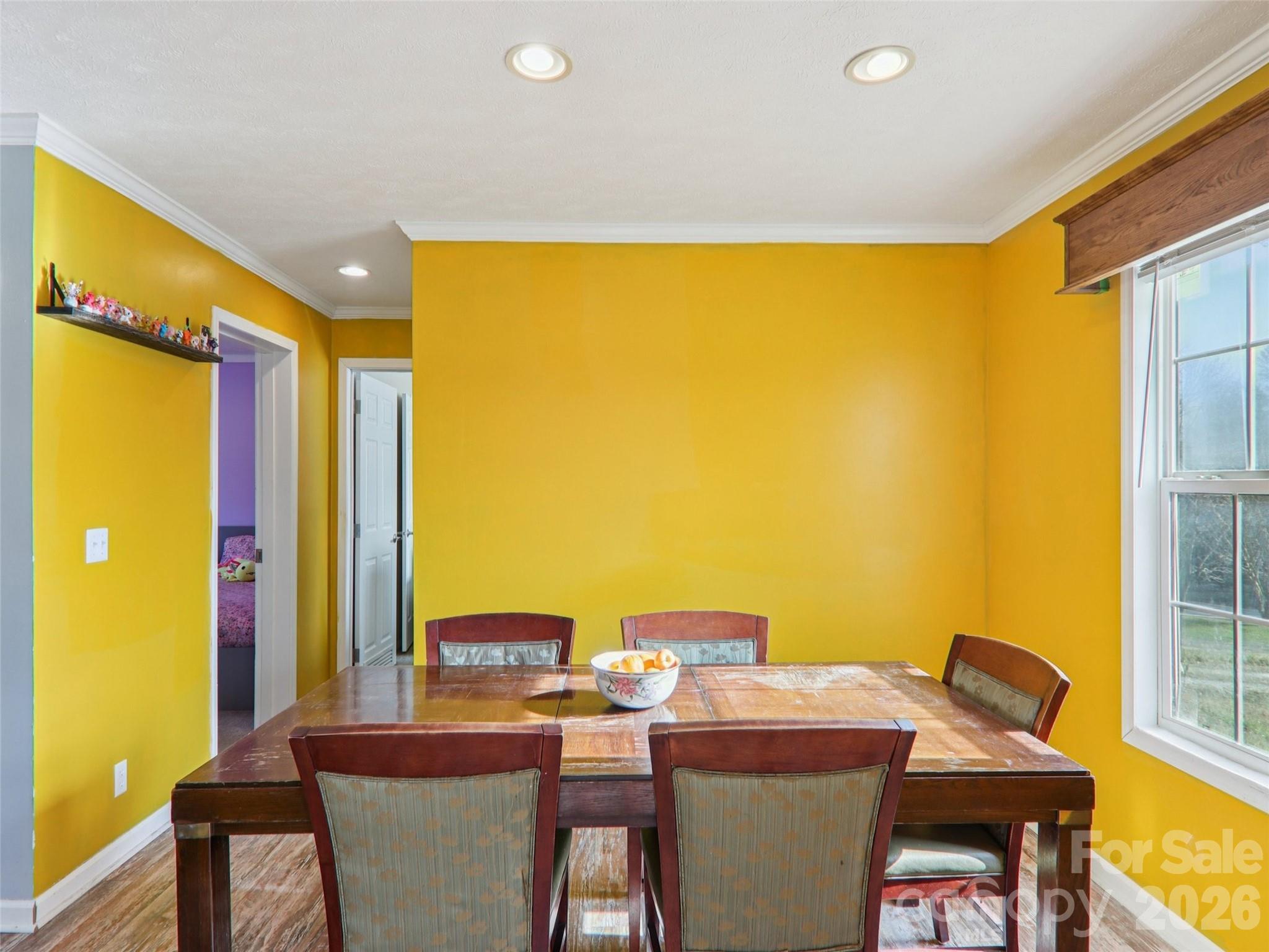 3195 North Clear Creek Road Hendersonville, NC 28792 - Photo 8 of 21 a room with a table and chairs