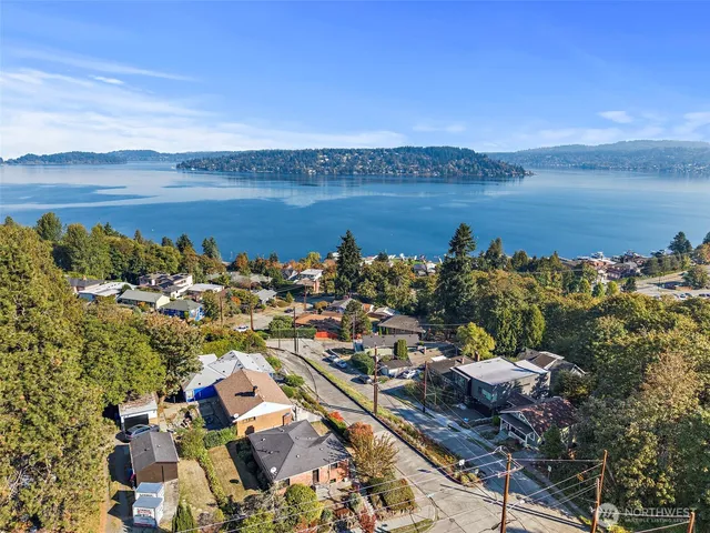 a view of a house with garden and trees