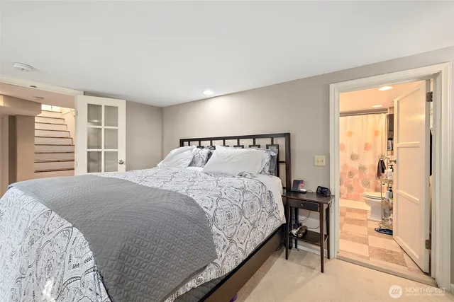 a bathroom with a sink toilet vanity and shower