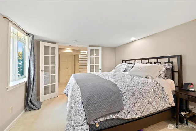 a view of walk in closet with clothes