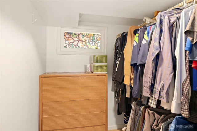 a aerial view of a house next to a yard