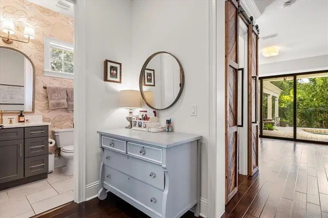 a view of a bathroom with a sink and mirror