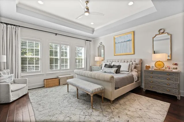 a spacious bedroom with a bed and a couch