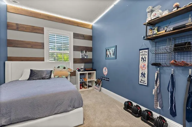 a bedroom with a bed and cabinets