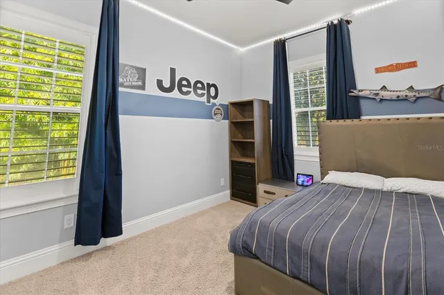 a bedroom with a bed and cabinets