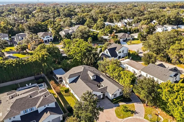 an aerial view of a house with a swimming pool
