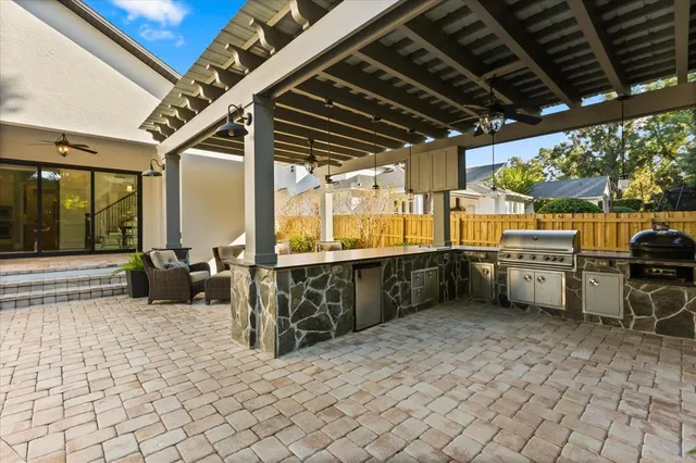 a view of a house with pool and sitting area