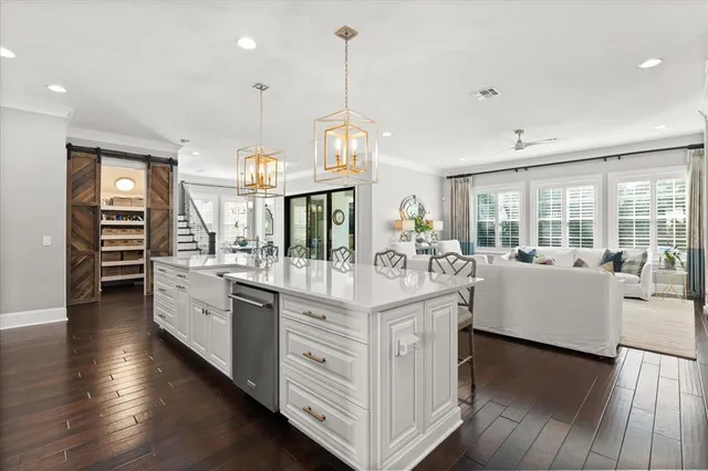 a view of living room with furniture and large windows