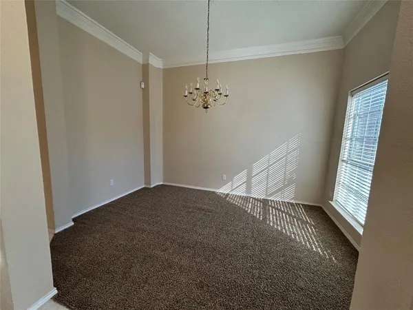a view of a hallway with staircase