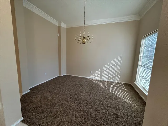 a view of a hallway with staircase