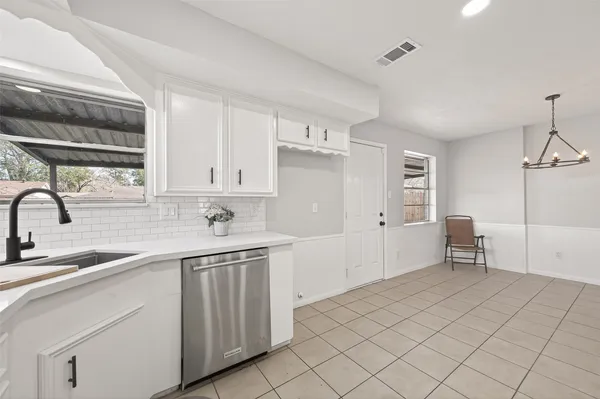 a kitchen with a stove and a sink