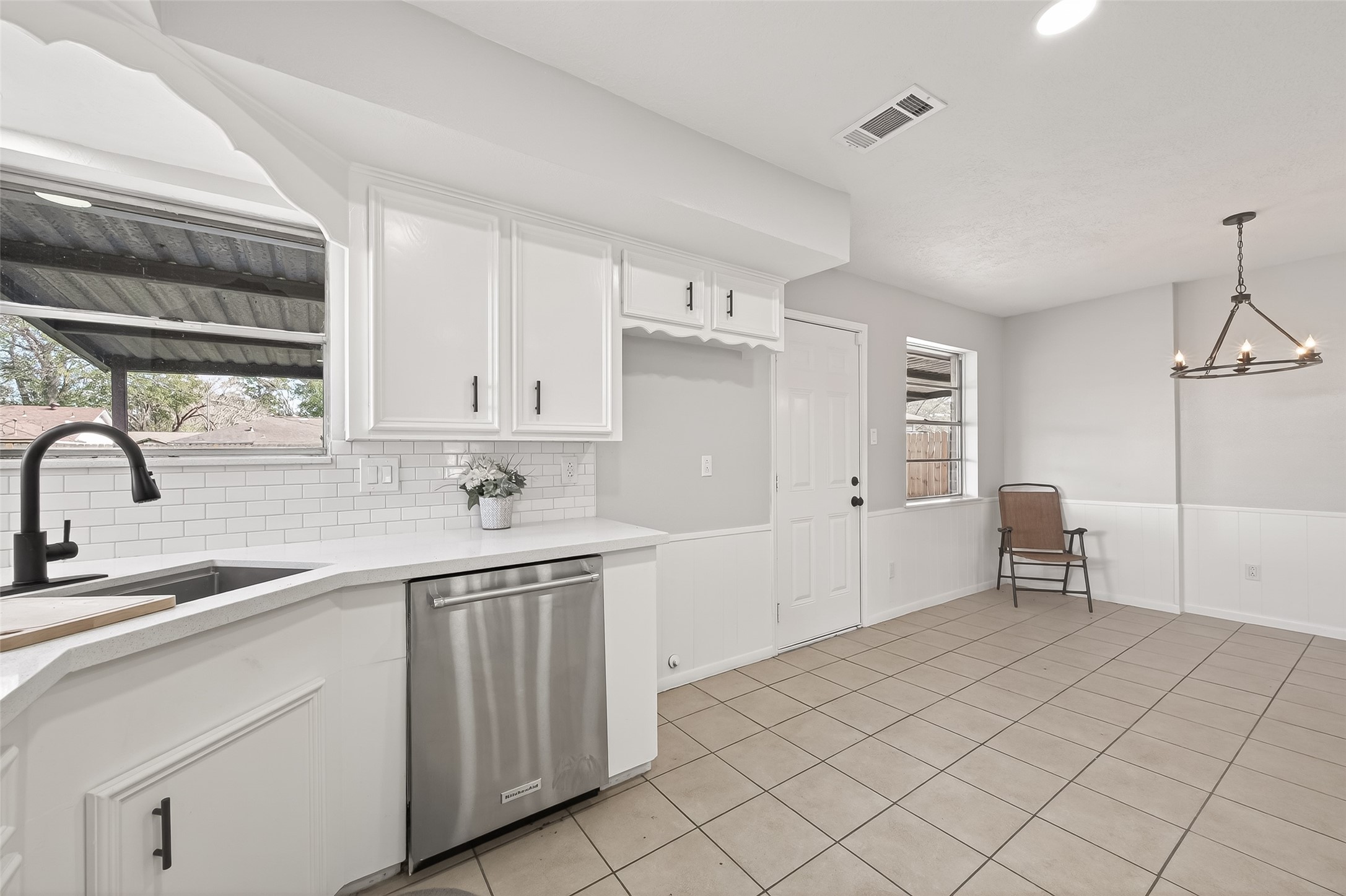 21710 Rotherham Drive Spring, TX 77388 - Photo 15 of 49 a kitchen with a sink cabinets and window