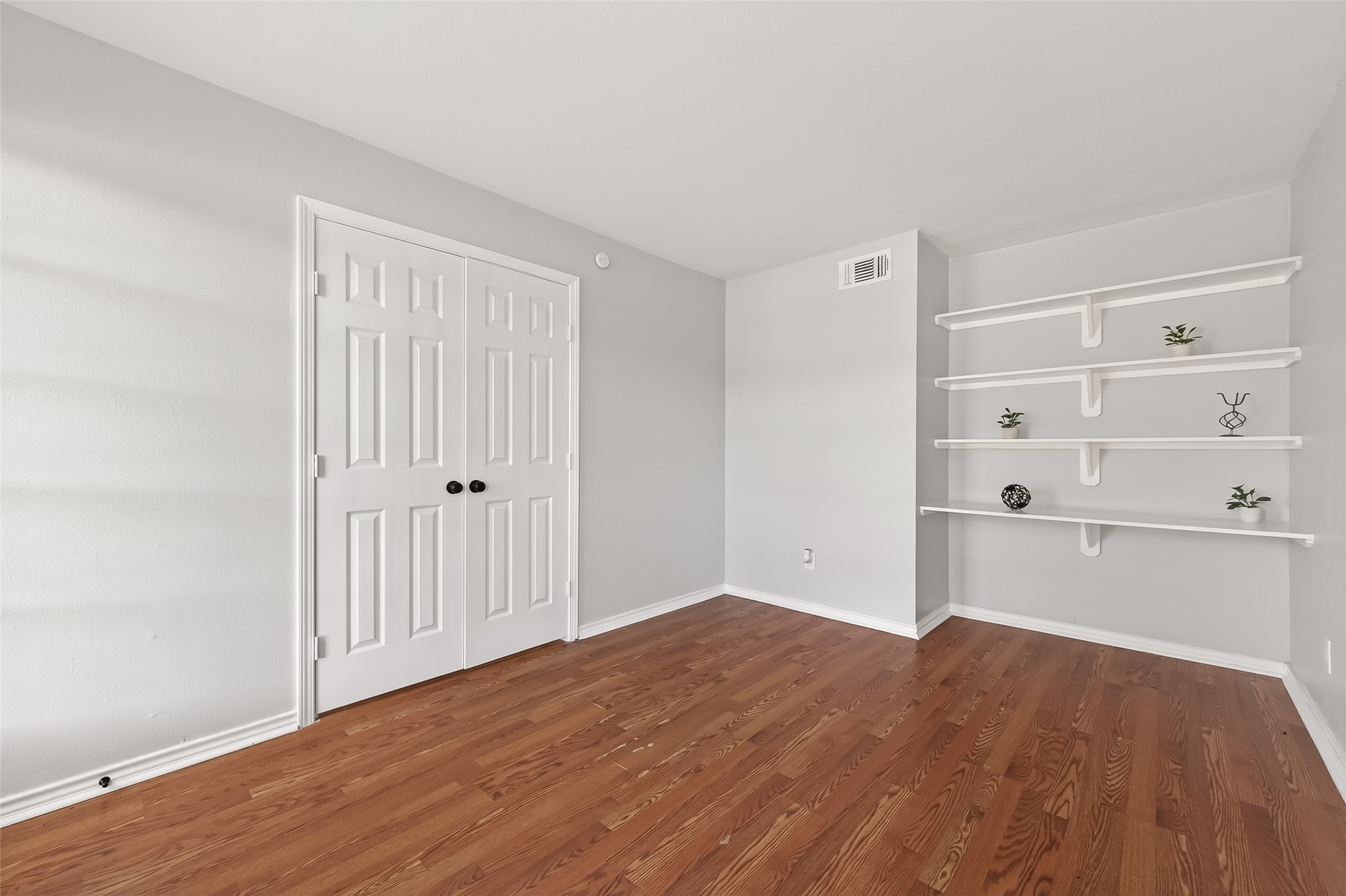 21710 Rotherham Drive Spring, TX 77388 - Photo 18 of 49 a view of empty room with wooden floor