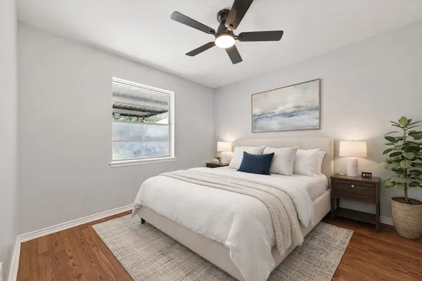 a dining room with furniture a chandelier and wooden floor