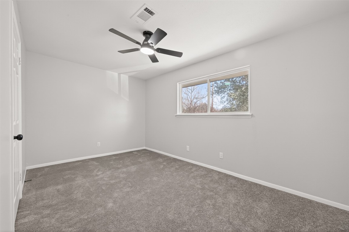 21710 Rotherham Drive Spring, TX 77388 - Photo 40 of 49 Fourth bedroom with carpet flooring, ceiling fan, and natural light.
