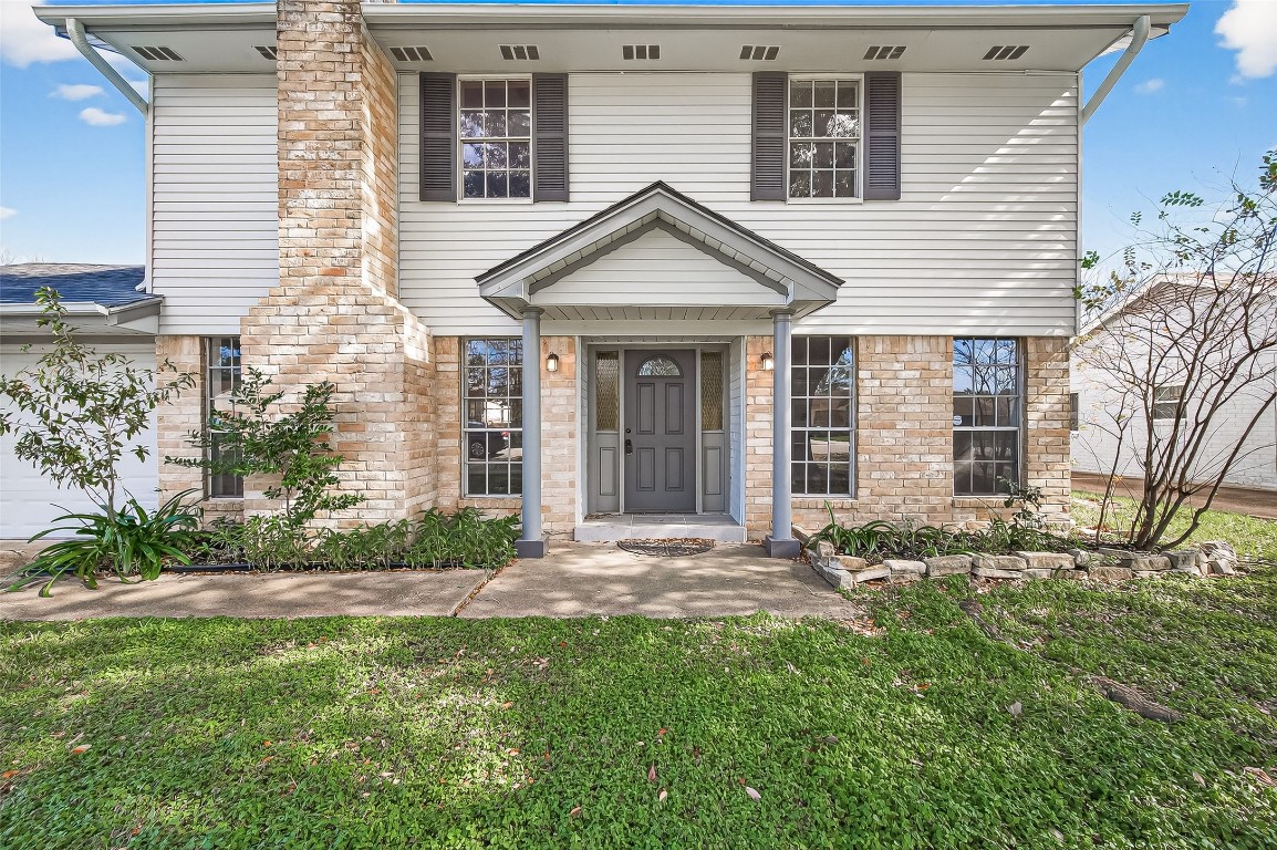 21710 Rotherham Drive Spring, TX 77388 - Photo 44 of 49 Front exterior view showcasing classic brick façade and welcoming entry.