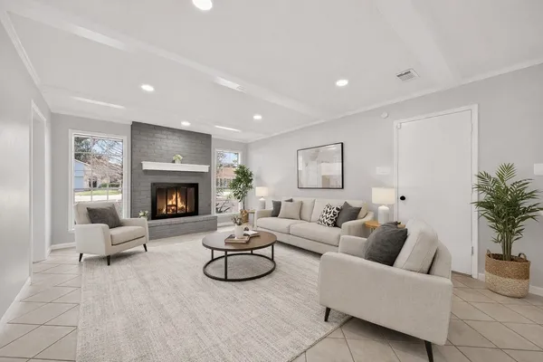 a living room with furniture and a fireplace