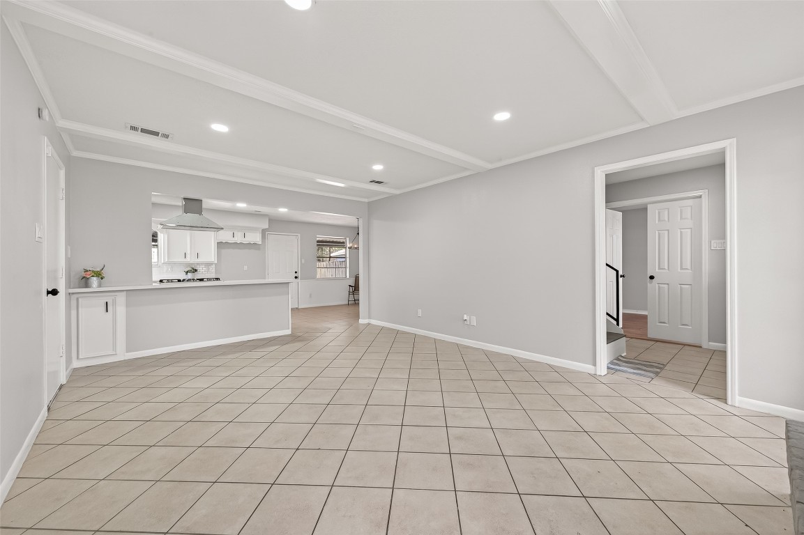 21710 Rotherham Drive Spring, TX 77388 - Photo 6 of 49 Open living area with tile flooring and recessed lighting with view of the kitchen