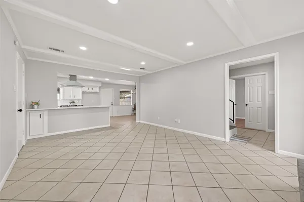 a view of a kitchen with white cabinets