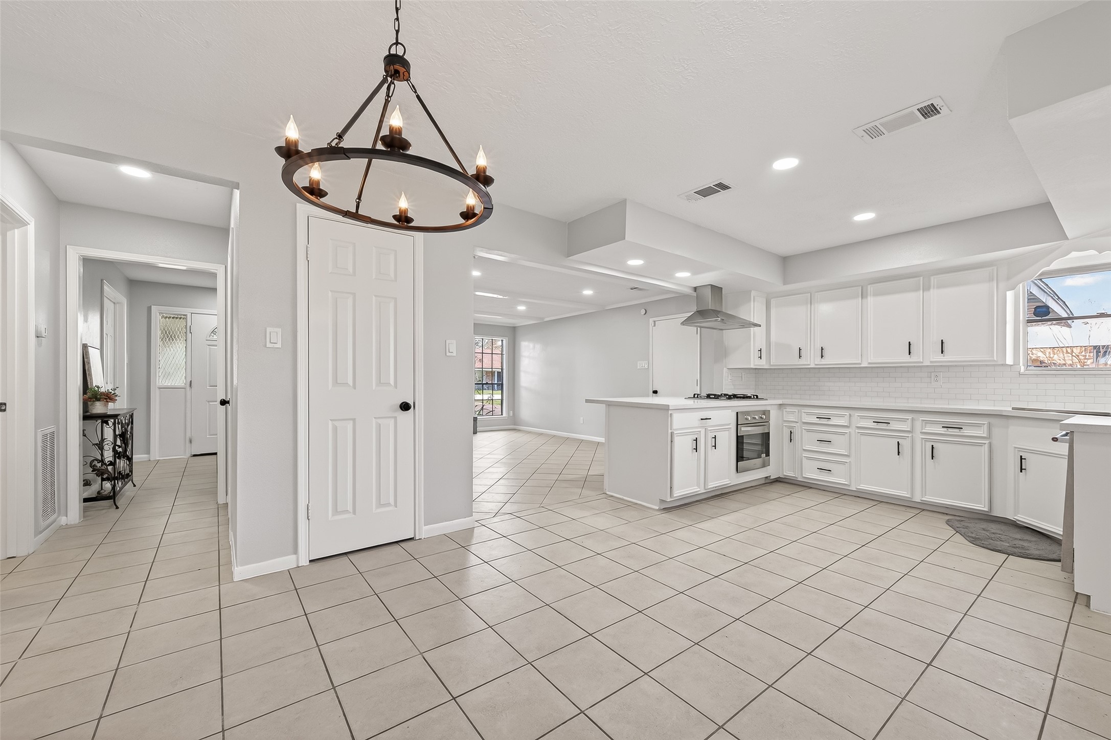 21710 Rotherham Drive Spring, TX 77388 - Photo 10 of 49 a kitchen with stainless steel appliances cabinets a sink and a stove