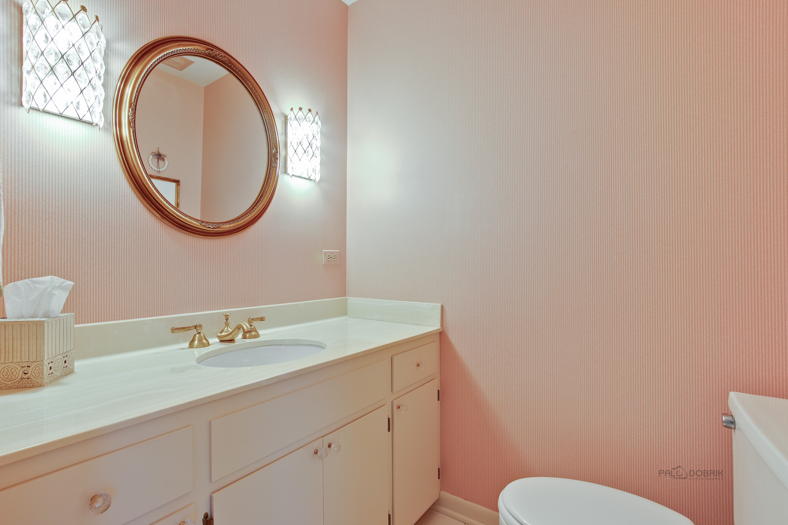 1207 Inverlieth Road Lake Forest, IL 60045 - Photo 5 of 37 a bathroom with a toilet sink and mirror