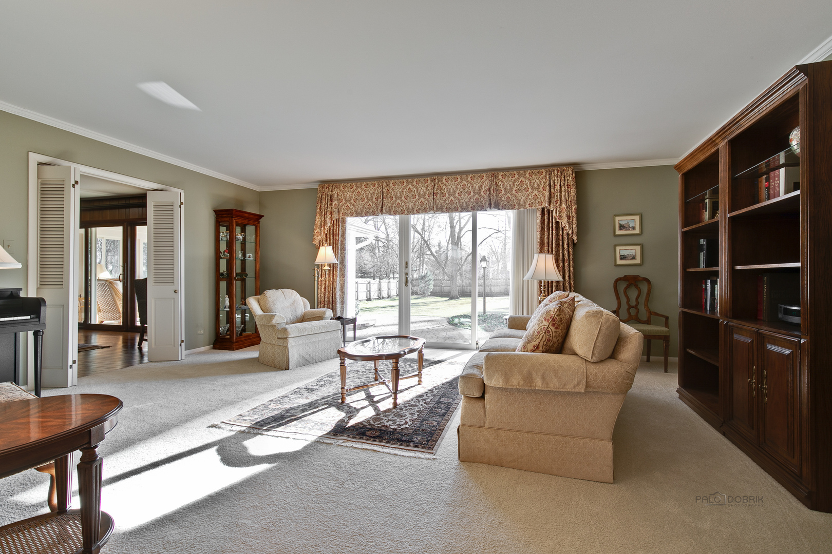 1207 Inverlieth Road Lake Forest, IL 60045 - Photo 6 of 37 a living room with furniture a rug and a large window