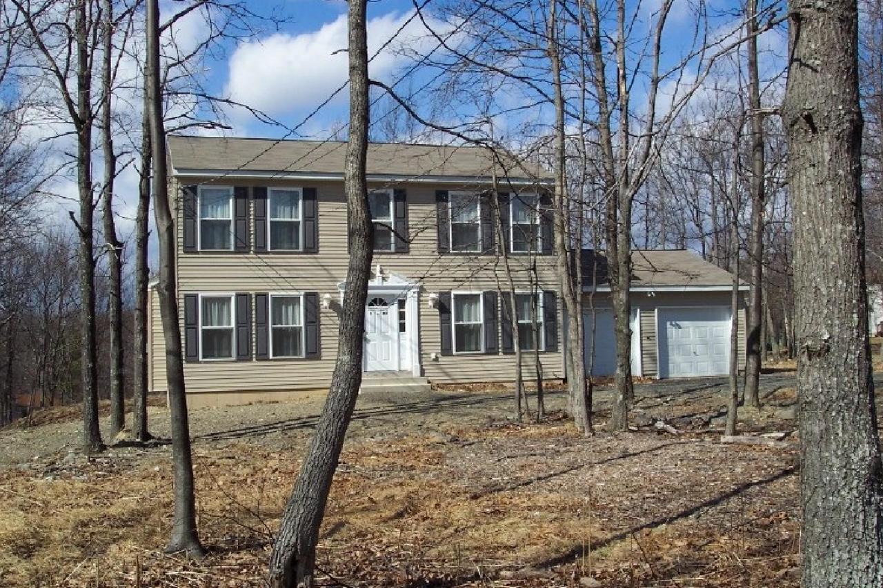 83 Snowflake Court Bushkill, PA 18324 - Photo 2 of 6 a view of a house with a yard and balcony