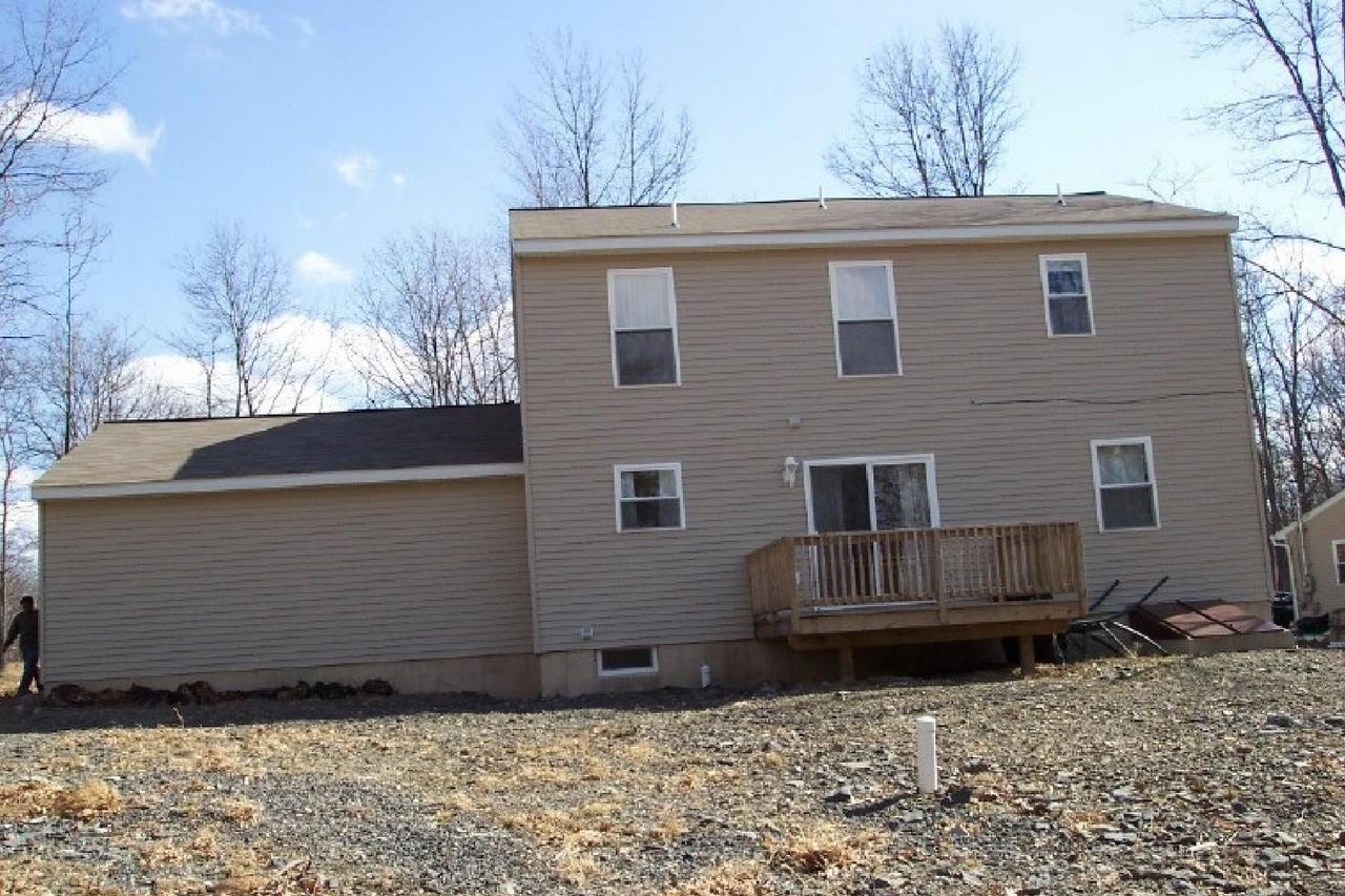 83 Snowflake Court Bushkill, PA 18324 - Photo 3 of 6 a view of a house with a yard