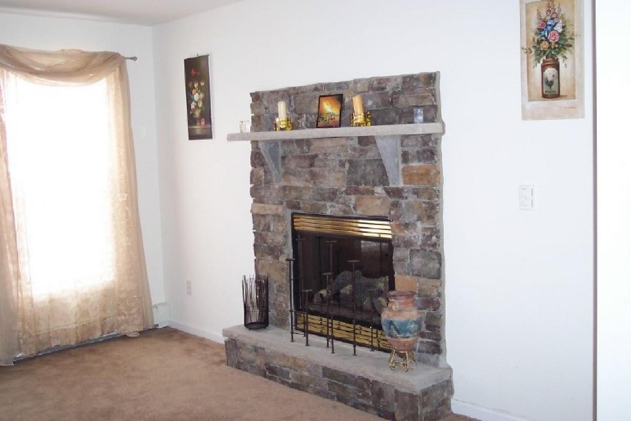 83 Snowflake Court Bushkill, PA 18324 - Photo 6 of 6 a living room with a fireplace