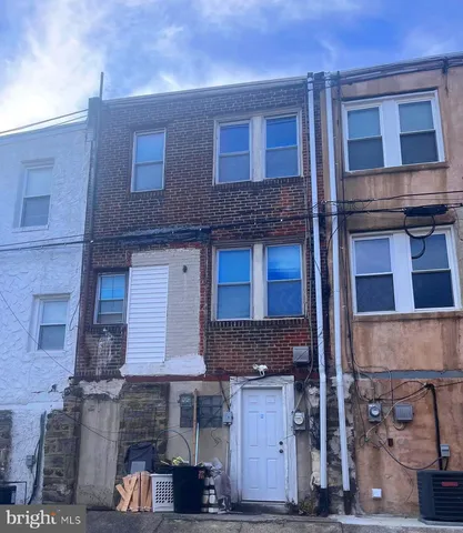a front view of a house with a garage