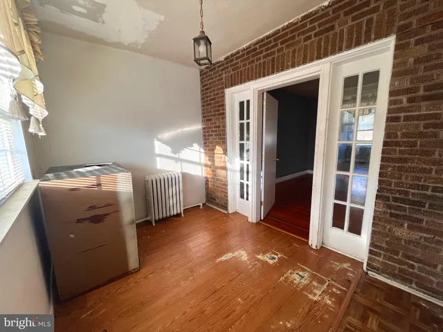 a view of an empty room with a fireplace