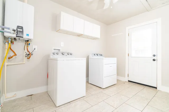 a utility room with dryer and washer