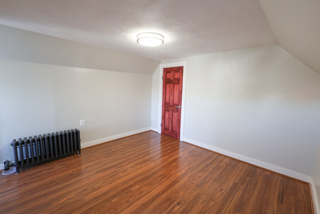 369 Savin Hill Avenue, Unit 3 Boston, MA 02125 - Photo 14 of 16 a view of an empty room with wooden floor