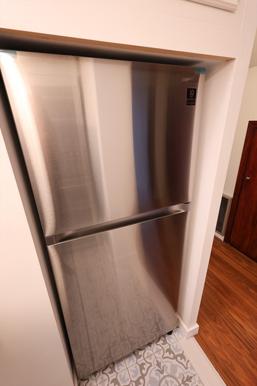 369 Savin Hill Avenue, Unit 3 Boston, MA 02125 - Photo 3 of 16 a view of walk in closet with wooden floor